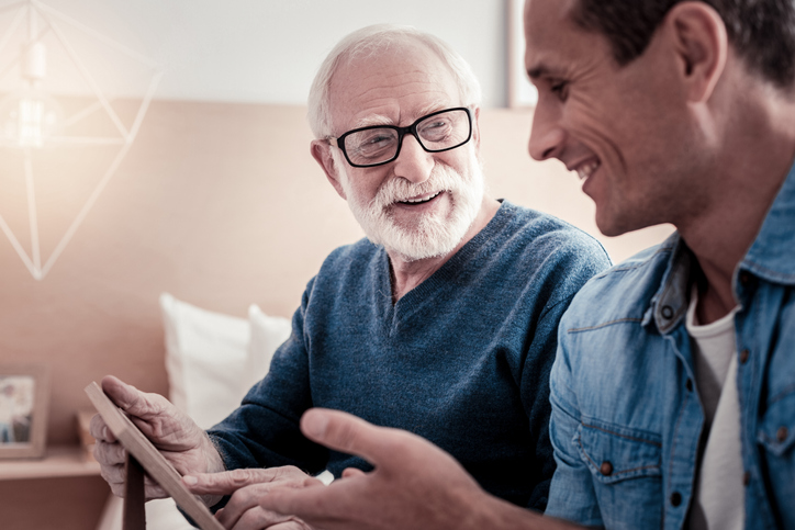 Pleasant communication. Cheerful nice pleasant smiling and talking to his grandfather while spending time with him (Pleasant communication. Cheerful nice pleasant smiling and talking to his grandfather while spending time with him, ASCII, 116 componen